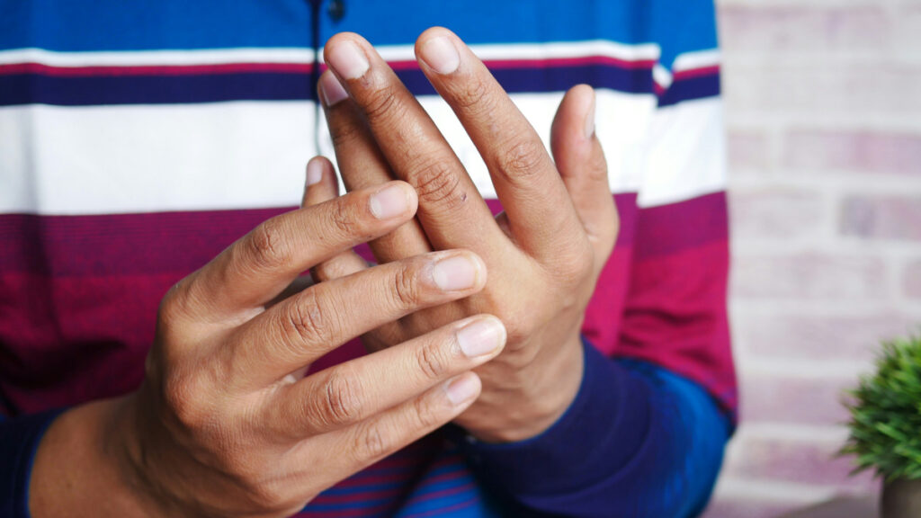 Man holding his wrist